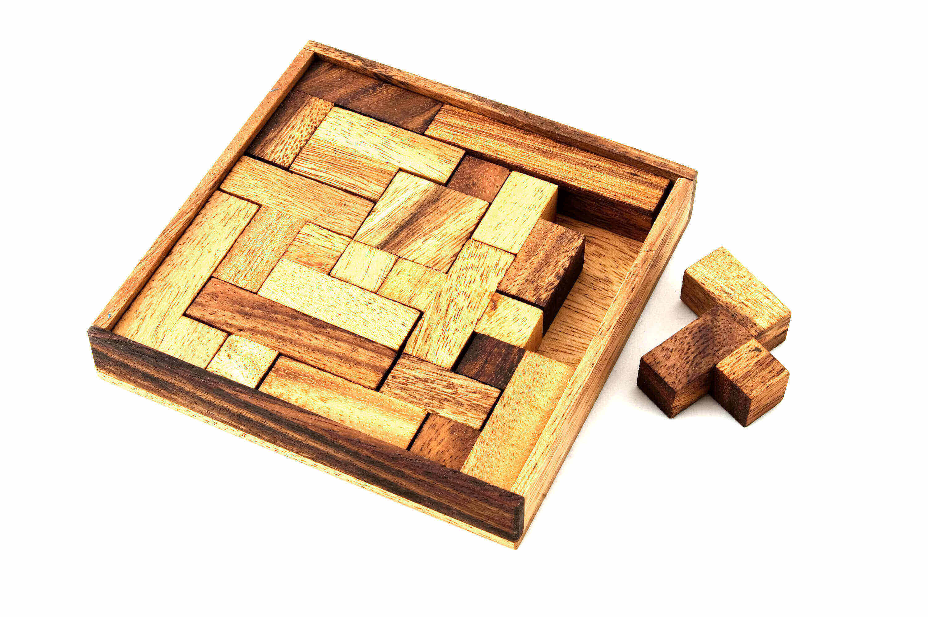A wooden puzzle with pieces missing.